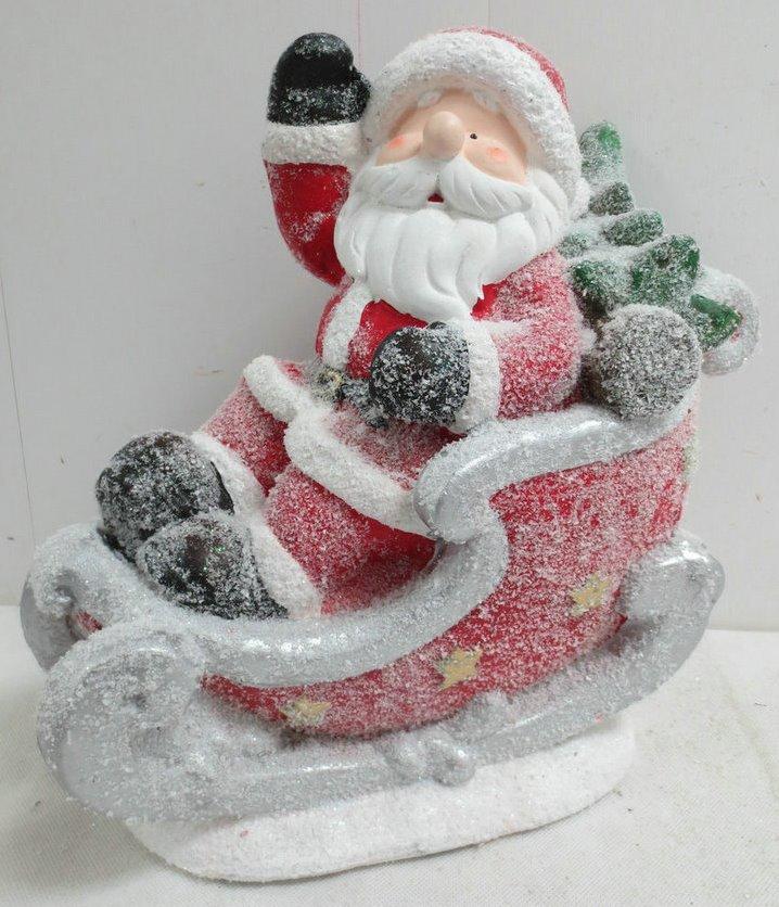 Santa in Snow Covered Sleigh