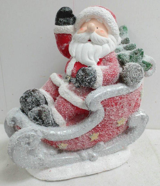 Santa in Snow Covered Sleigh